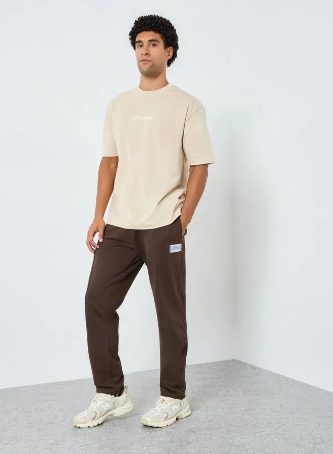 Styli Men Slim Fit Terry Paneled Elasticated Joggers